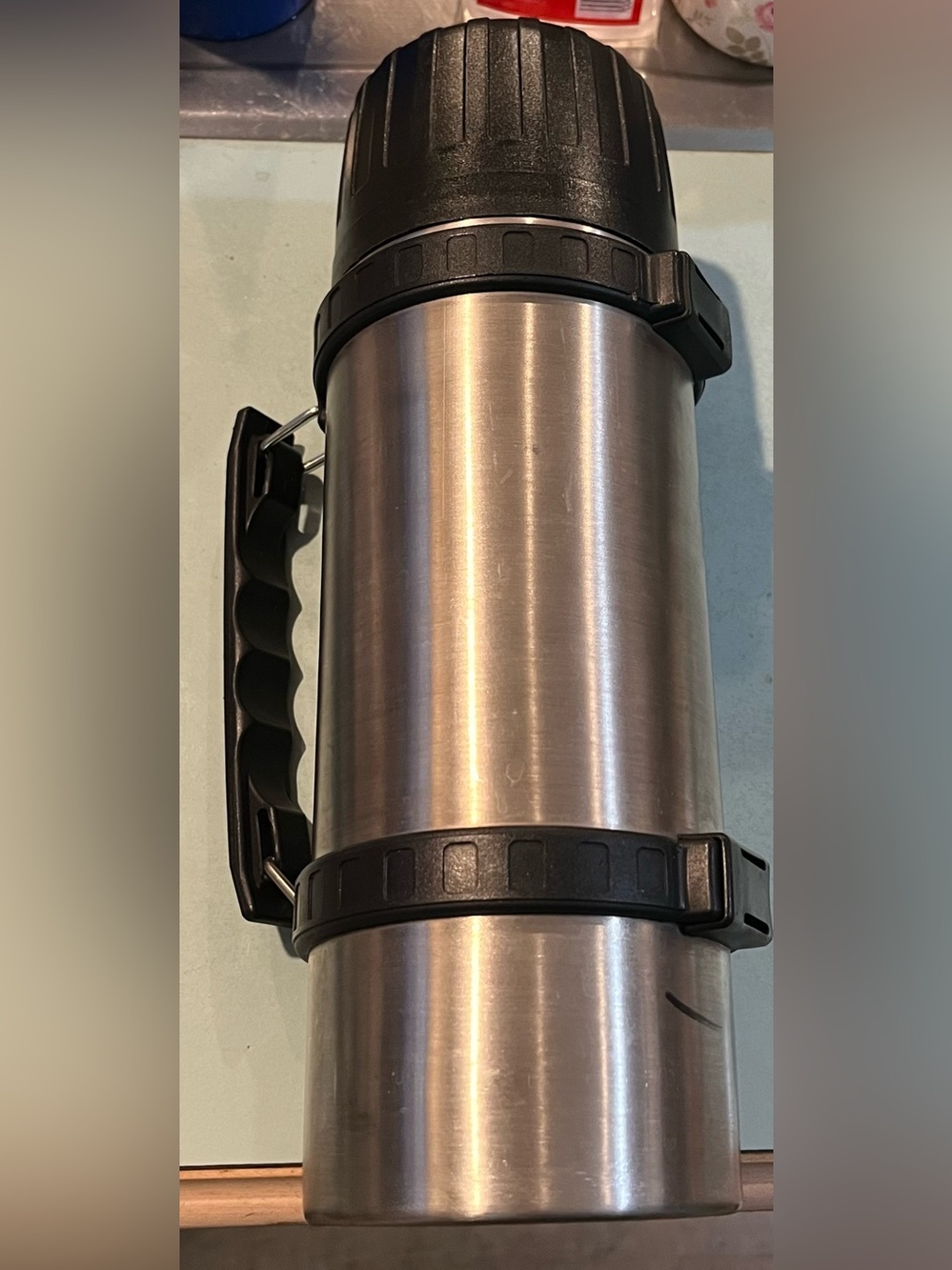 Thermos Stainless Steel Bottle with Black Handle and Lid .99 litre